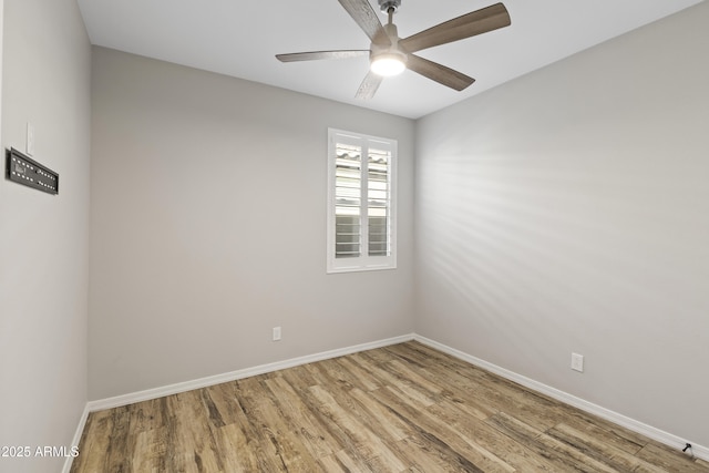 spare room featuring ceiling fan and hardwood / wood-style floors