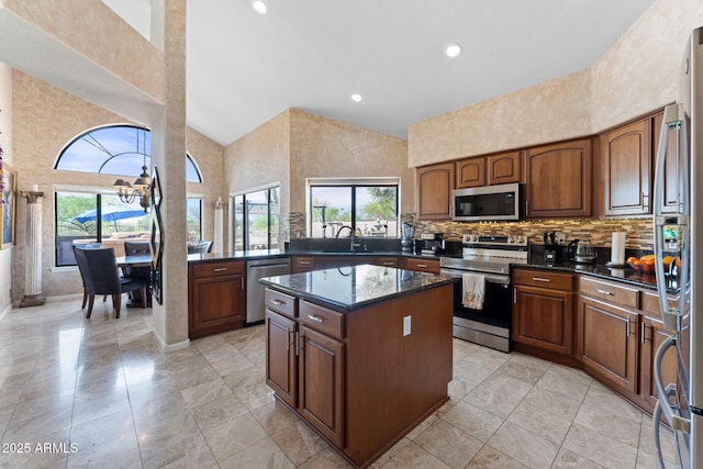 29806 N 43rd Pl, Cave Creek, AZ 85331 - kitchen with recessed lighting, a center island, a high ceiling, a sink, and stainless steel appliances