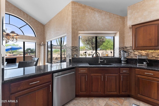 29806 N 43rd Pl, Cave Creek, AZ 85331 - kitchen with tasteful backsplash, dark stone countertops, high vaulted ceiling, dishwasher, and a sink