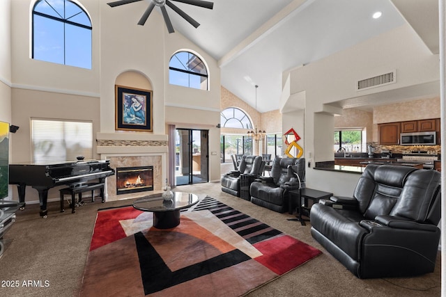 29806 N 43rd Pl, Cave Creek, AZ 85331 - carpeted living room with visible vents, high vaulted ceiling, a high end fireplace, and a ceiling fan
