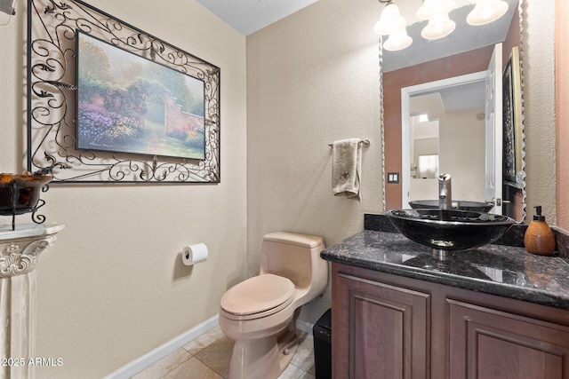 29806 N 43rd Pl, Cave Creek, AZ 85331 - half bathroom with vanity, toilet, a chandelier, tile patterned floors, and baseboards