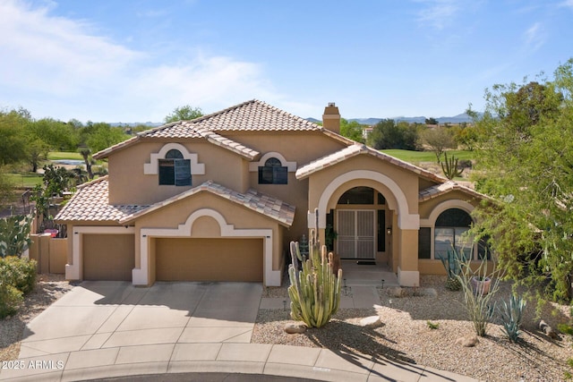 29806 N 43rd Pl, Cave Creek, AZ 85331 - mediterranean / spanish-style house featuring stucco siding, a chimney, driveway, a tile roof, and a garage
