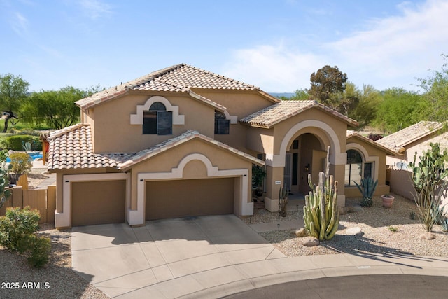 29806 N 43rd Pl, Cave Creek, AZ 85331 - mediterranean / spanish house featuring concrete driveway, a tile roof, fence, and stucco siding