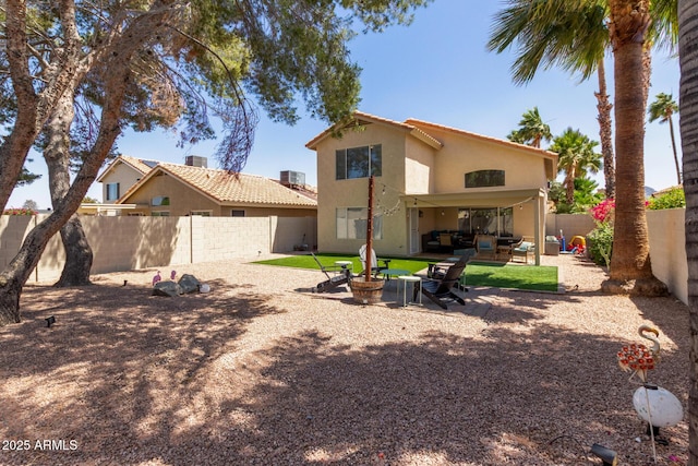 3222 E Cortez St, Phoenix, AZ 85028 - back of property with stucco siding, a fenced backyard, a patio area, and an outdoor living space