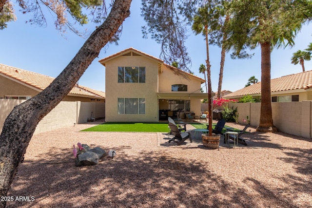 3222 E Cortez St, Phoenix, AZ 85028 - rear view of property with a fenced backyard, stucco siding, outdoor lounge area, a patio, and a tiled roof