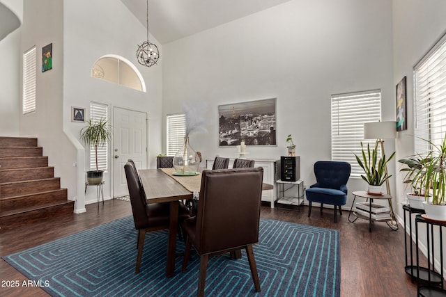 3222 E Cortez St, Phoenix, AZ 85028 - dining area featuring high vaulted ceiling, wood finished floors, stairs, a chandelier, and baseboards