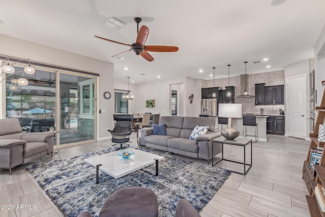 4876 N 207th Ln, Buckeye, AZ 85396 - living room featuring a ceiling fan, visible vents, and recessed lighting