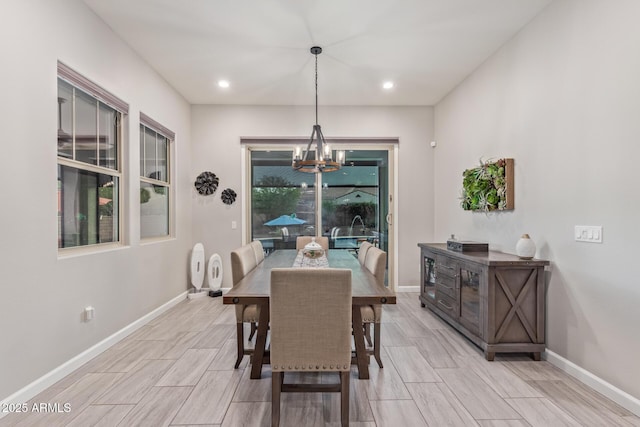 4876 N 207th Ln, Buckeye, AZ 85396 - dining space featuring an inviting chandelier, baseboards, wood finish floors, and recessed lighting