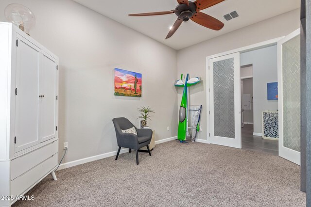 4876 N 207th Ln, Buckeye, AZ 85396 - living area with ceiling fan, visible vents, baseboards, and carpet floors