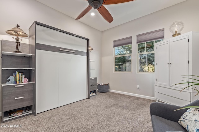 4876 N 207th Ln, Buckeye, AZ 85396 - living area featuring carpet flooring, baseboards, and a ceiling fan