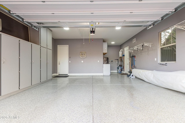 4876 N 207th Ln, Buckeye, AZ 85396 - garage featuring visible vents and a garage door opener