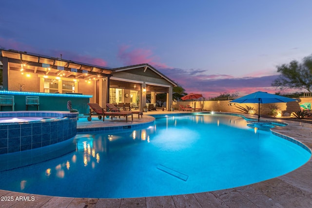 4876 N 207th Ln, Buckeye, AZ 85396 - view of pool with a patio, a pool with connected hot tub, and fence