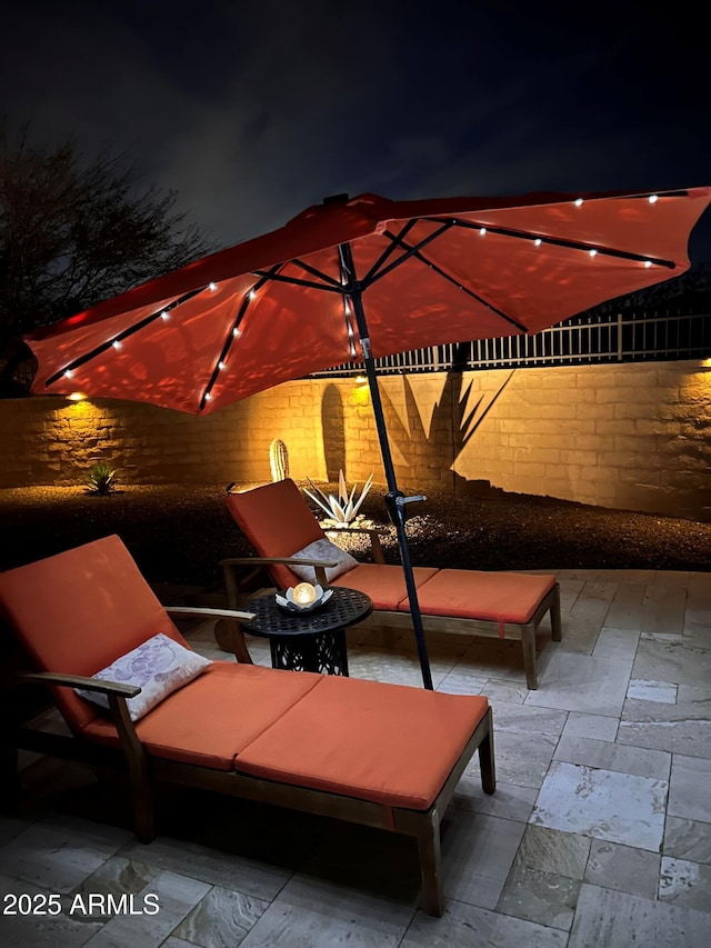 4876 N 207th Ln, Buckeye, AZ 85396 - patio at twilight with fence