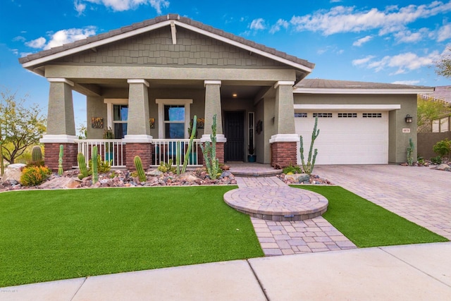 4876 N 207th Ln, Buckeye, AZ 85396 - craftsman house featuring stucco siding, driveway, an attached garage, a front yard, and a porch