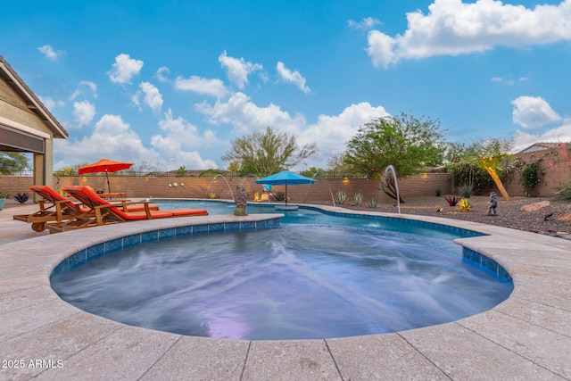 4876 N 207th Ln, Buckeye, AZ 85396 - view of swimming pool featuring a fenced backyard, a fenced in pool, and a patio