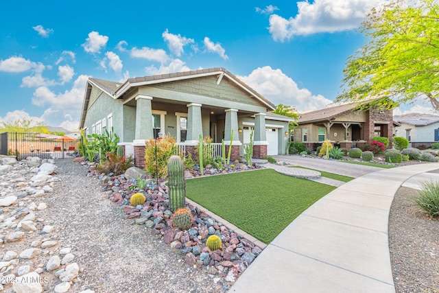 4876 N 207th Ln, Buckeye, AZ 85396 - craftsman inspired home featuring an attached garage, covered porch, fence, stucco siding, and driveway