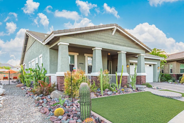 4876 N 207th Ln, Buckeye, AZ 85396 - craftsman inspired home featuring stucco siding, a porch, fence, an attached garage, and concrete driveway