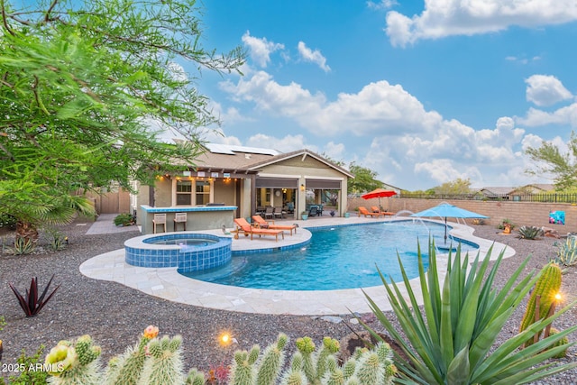 4876 N 207th Ln, Buckeye, AZ 85396 - view of swimming pool with a patio, a fenced backyard, and a pool with connected hot tub