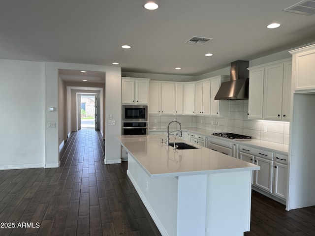 6947 W Spur Dr, Peoria, AZ 85383 - kitchen with a sink, wall chimney exhaust hood, stainless steel appliances, dark wood-type flooring, and recessed lighting