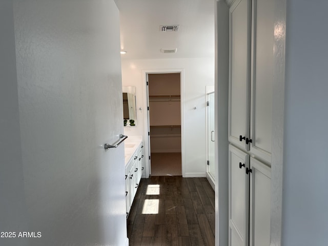 6947 W Spur Dr, Peoria, AZ 85383 - corridor with dark wood finished floors and baseboards