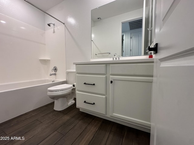 6947 W Spur Dr, Peoria, AZ 85383 - bathroom featuring toilet, vanity, shower / bath combination, and wood finished floors