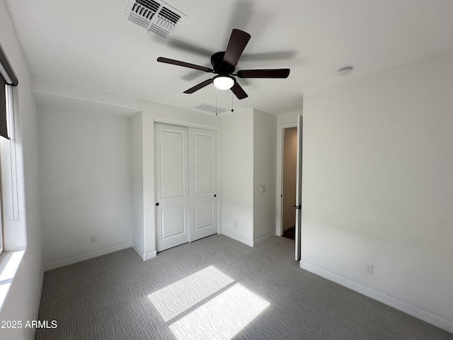 6947 W Spur Dr, Peoria, AZ 85383 - unfurnished bedroom featuring carpet, baseboards, a closet, and a ceiling fan