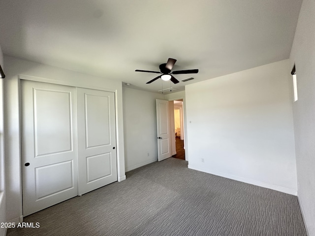 6947 W Spur Dr, Peoria, AZ 85383 - unfurnished bedroom with carpet, baseboards, a closet, and ceiling fan