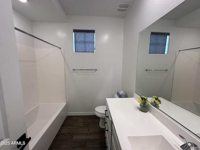 6947 W Spur Dr, Peoria, AZ 85383 - full bath with wood finished floors, toilet, vanity, baseboards, and shower / bathtub combination