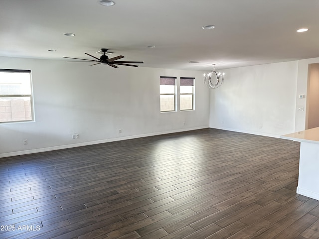 6947 W Spur Dr, Peoria, AZ 85383 - unfurnished room with a chandelier, dark wood finished floors, recessed lighting, ceiling fan, and baseboards