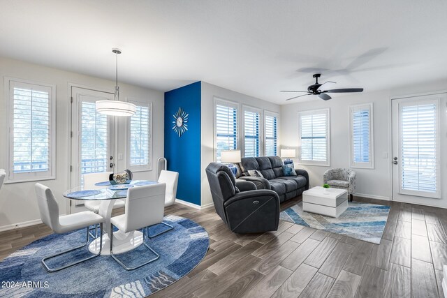 dining room featuring ceiling fan and dark hardwood / wood-style floors