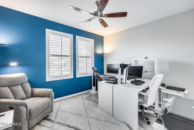 office space featuring light colored carpet and ceiling fan