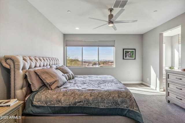 bedroom featuring light colored carpet and ceiling fan