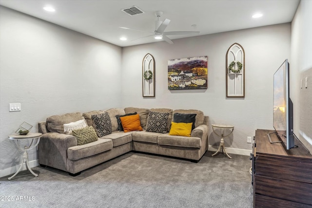 living room featuring carpet floors and ceiling fan