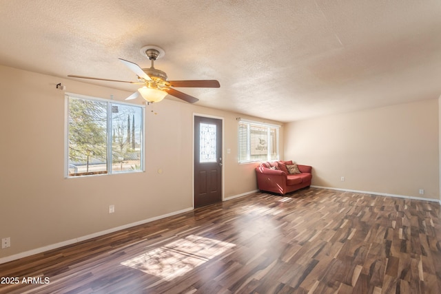 4565 Aspen Dr, Sierra Vista, AZ 85635 - entrance foyer with ceiling fan, dark hardwood / wood-style floors, and a textured ceiling