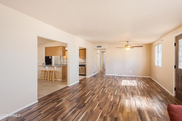 4565 Aspen Dr, Sierra Vista, AZ 85635 - unfurnished living room featuring a textured ceiling, ceiling fan, and dark hardwood / wood-style floors