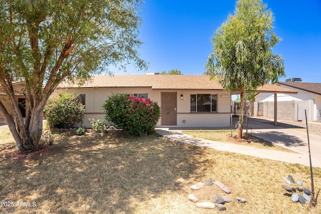 1310 E Ironwood Dr, Buckeye, AZ 85326 - single story home with a carport, stucco siding, and concrete driveway