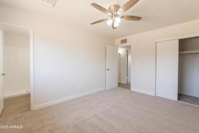 1310 E Ironwood Dr, Buckeye, AZ 85326 - unfurnished bedroom featuring carpet flooring, baseboards, a closet, and a ceiling fan