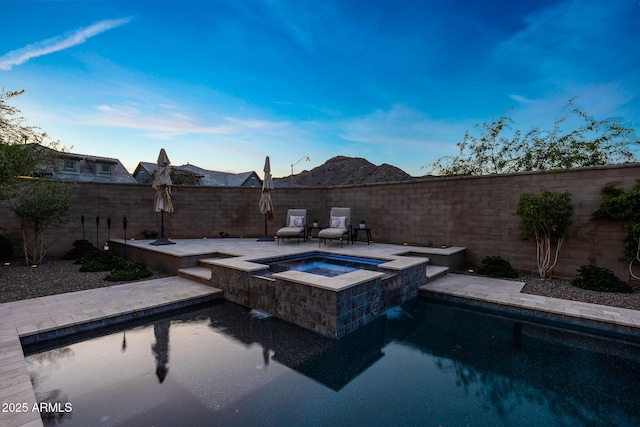 21194 W Hillcrest Blvd, Buckeye, AZ 85396 - view of swimming pool featuring a fenced backyard, a pool with connected hot tub, and a patio