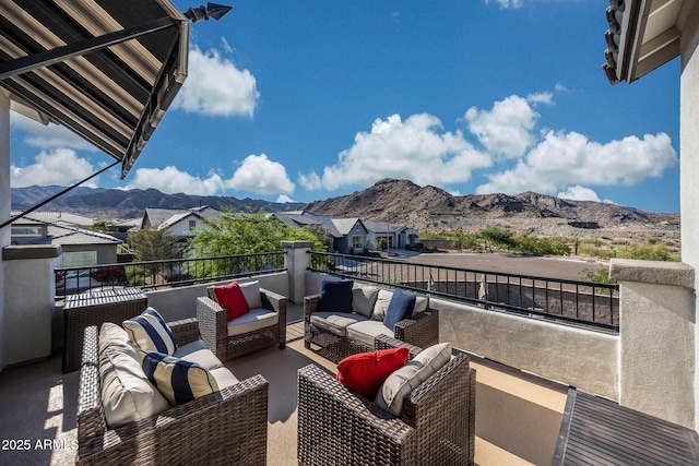 21194 W Hillcrest Blvd, Buckeye, AZ 85396 - view of patio / terrace with a mountain view, a balcony, and outdoor lounge area