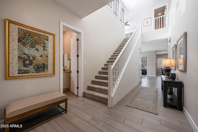 21194 W Hillcrest Blvd, Buckeye, AZ 85396 - stairs with baseboards and wood finished floors