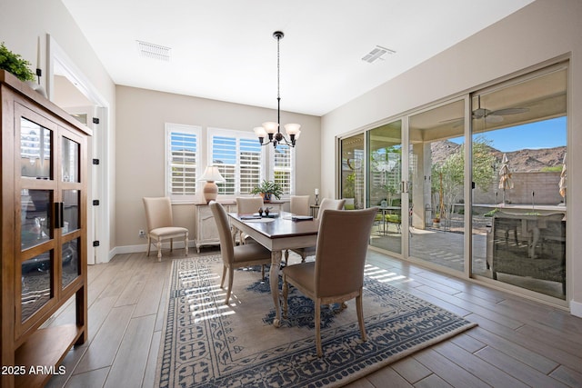 21194 W Hillcrest Blvd, Buckeye, AZ 85396 - dining space featuring light wood-style flooring, plenty of natural light, and baseboards