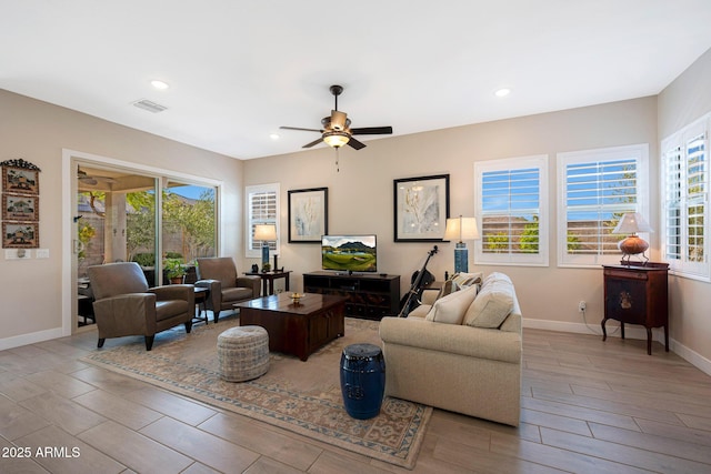 21194 W Hillcrest Blvd, Buckeye, AZ 85396 - living room featuring a ceiling fan, wood finish floors, baseboards, and recessed lighting