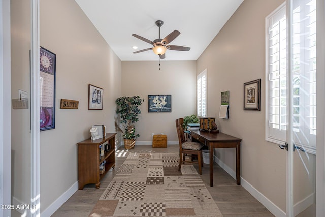 21194 W Hillcrest Blvd, Buckeye, AZ 85396 - office featuring baseboards, a ceiling fan, light wood-style flooring, and recessed lighting