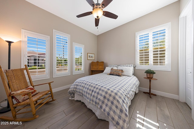 21194 W Hillcrest Blvd, Buckeye, AZ 85396 - bedroom with baseboards, light wood-type flooring, and a ceiling fan