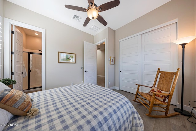 21194 W Hillcrest Blvd, Buckeye, AZ 85396 - bedroom featuring wood finished floors, baseboards, a closet, a ceiling fan, and ensuite bath