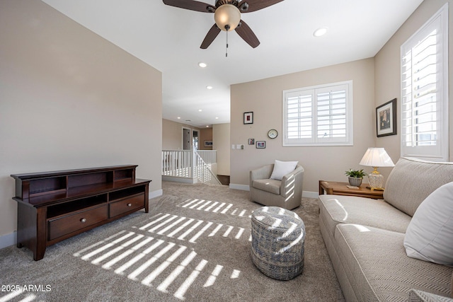 21194 W Hillcrest Blvd, Buckeye, AZ 85396 - carpeted living room with plenty of natural light, ceiling fan, baseboards, and recessed lighting