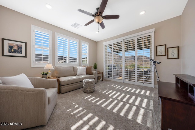21194 W Hillcrest Blvd, Buckeye, AZ 85396 - carpeted living area with ceiling fan and recessed lighting