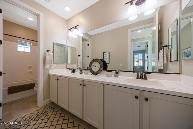 21194 W Hillcrest Blvd, Buckeye, AZ 85396 - bathroom featuring double vanity, shower / bathtub combination, toilet, and healthy amount of natural light