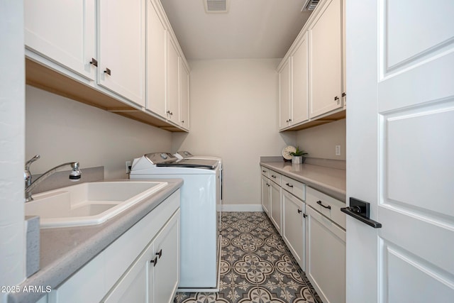 21194 W Hillcrest Blvd, Buckeye, AZ 85396 - washroom with cabinet space, separate washer and dryer, baseboards, and tile patterned flooring