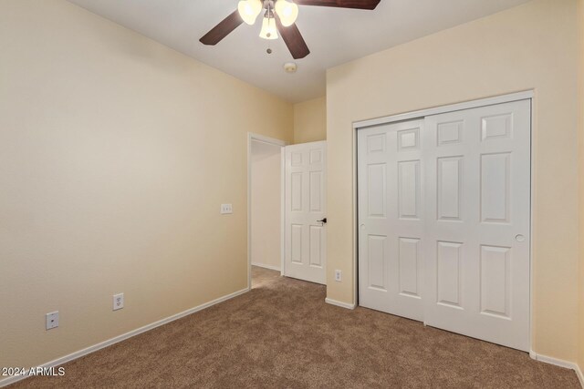 6321 S Teresa Dr, Chandler, AZ 85249 - unfurnished bedroom featuring carpet, baseboards, a closet, and a ceiling fan